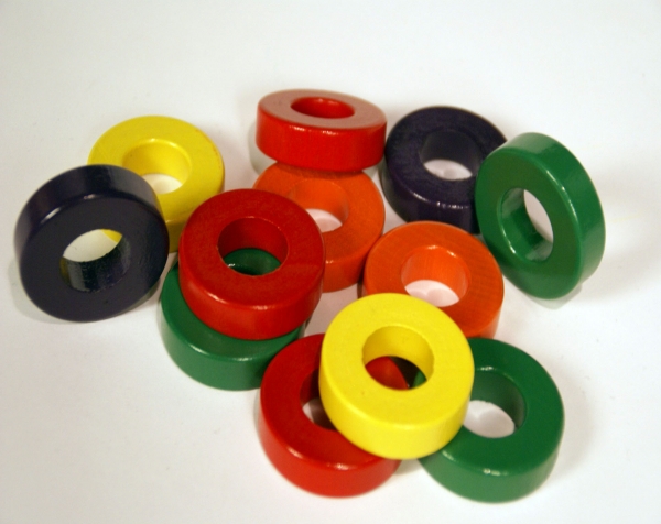 Group of Painted Turned Wood Rings in a Variety of Colors